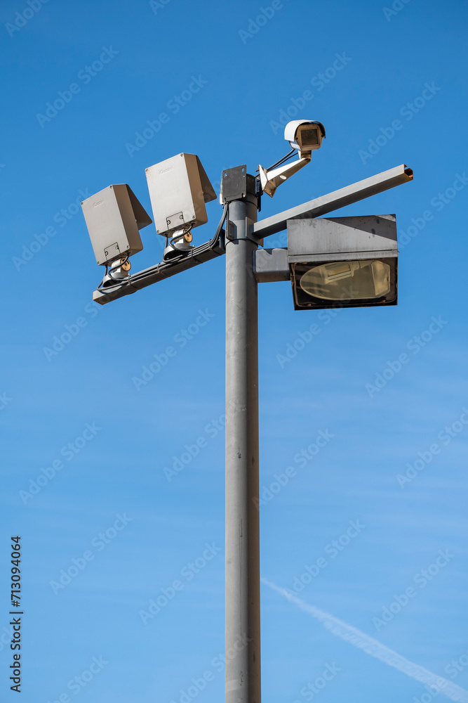 Security camera on the public road. Video surveillance and lighting systems.Surveillance with security cameras on the street for the safety of citizens. Security camera on the public road. Video surveillance and lighting systems.Surveillance with security cameras on the street for the safety of citizens.