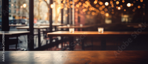 Wooden cafe table bokeh background, empty wood desk restaurant tabletop counter in bar or coffee shop surface product display mockup with blurry city lights backdrop presentation. Mock up, copy space.