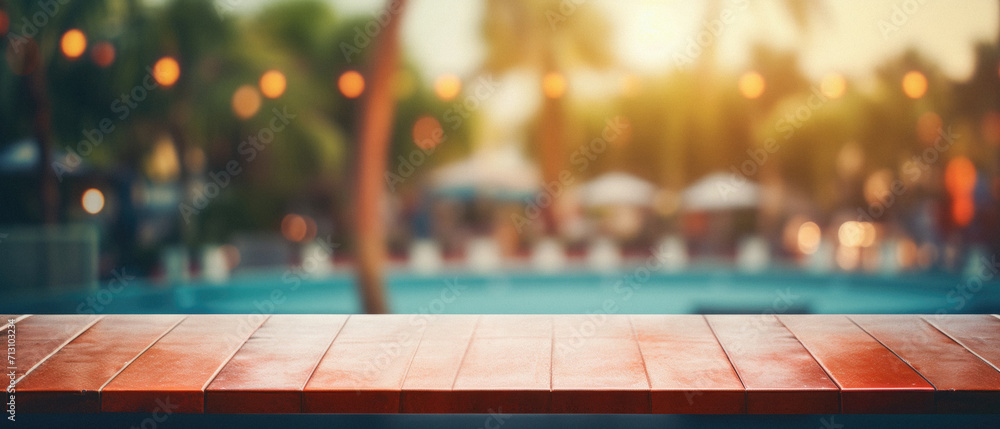 Wooden table pool bokeh background, empty wood desk product display mockup with blurry tropical hotel resort abstract poolside summer travel backdrop advertising presentation. Mock up, copy space. - obrazy, fototapety, plakaty 
