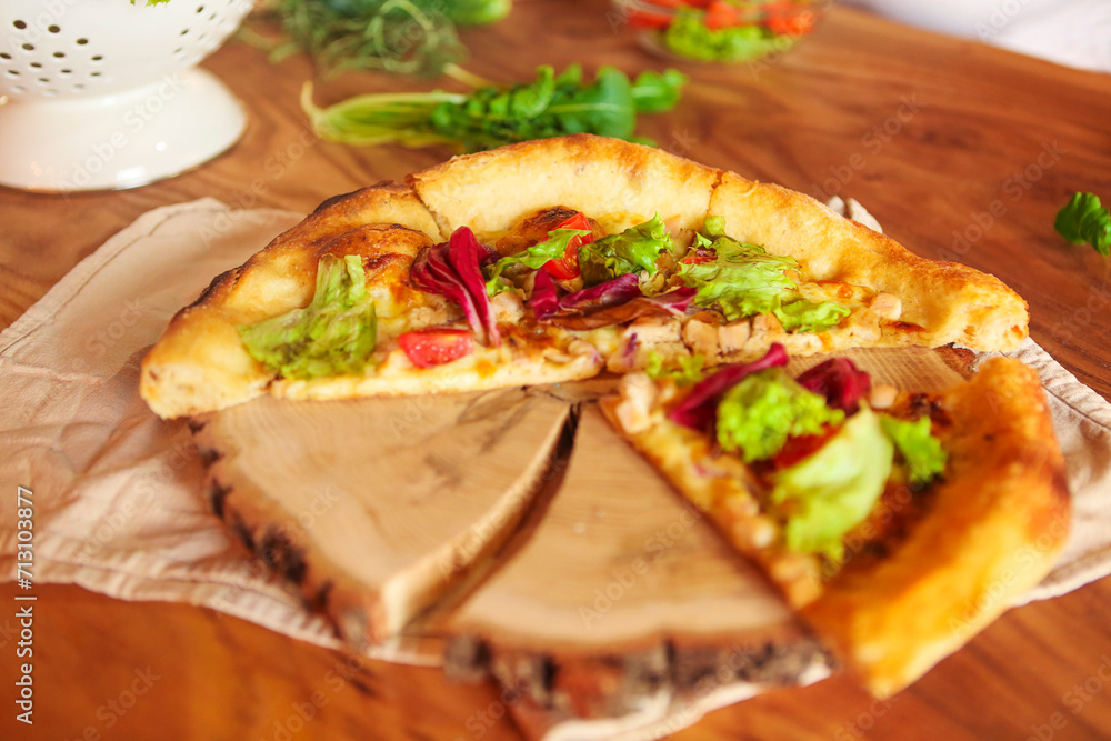 Homemade pizza on wooden background
