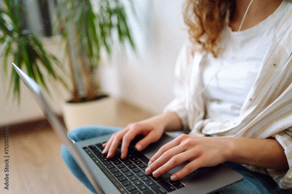 Close-up of hands working on a laptop keyboard. Woman text response to client's email, buyer buys online using online store services. Concept of using the Internet and modern wireless technologies Close-up of hands working on a laptop keyboard. Woman text response to client's email, buyer buys online using online store services. Concept of using the Internet and modern wireless technologies