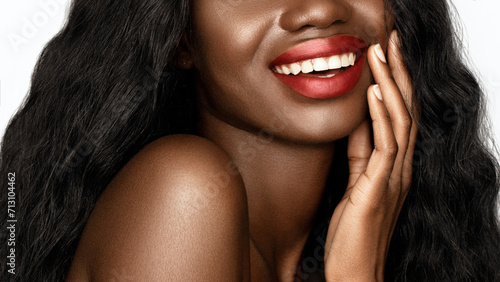 Red lips make up. Cropped portrait Beautiful African American model with a glowing skin and long wavy hair is smiling.