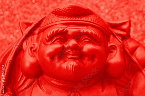 Face of Japanese fortune god statue. © KenamiRyoko