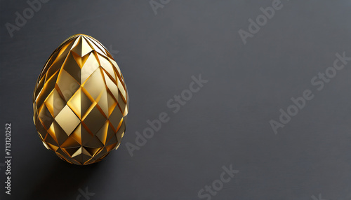 Golden Easter egg on dark background with copy space