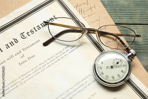 Last Will and Testament, pocket watch and glasses on rustic wooden table, closeup