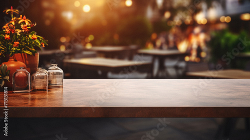 Wooden cafe table bokeh background, empty wood desk restaurant tabletop counter in bar or coffee shop surface product display mockup with blurry city lights backdrop presentation. Mock up, copy space.