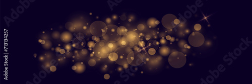 Shining bokeh  golden lights of light with flare particles. Christmas background.
