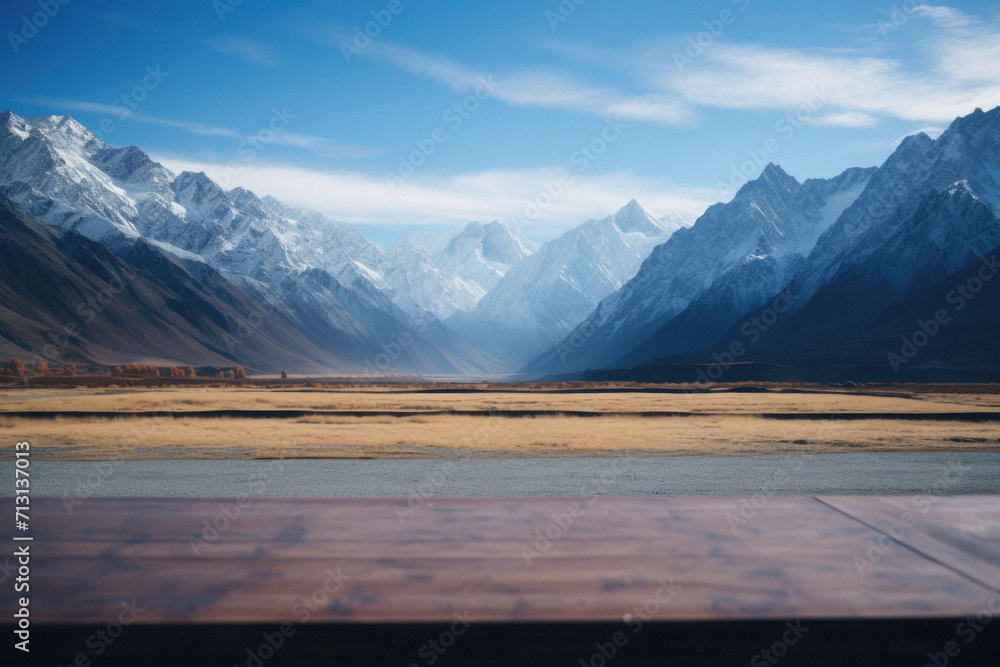 Wooden table mountains bokeh background, empty wood desk surface product display mockup with blurry nature hills landscape abstract travel backdrop advertising presentation. Mock up, copy space. Wooden table mountains bokeh background, empty wood desk surface product display mockup with blurry nature hills landscape abstract travel backdrop advertising presentation. Mock up, copy space.