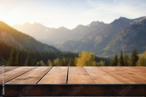 Wooden table mountains bokeh background, empty wood desk surface product display mockup with blurry nature hills landscape abstract travel backdrop advertising presentation. Mock up, copy space.