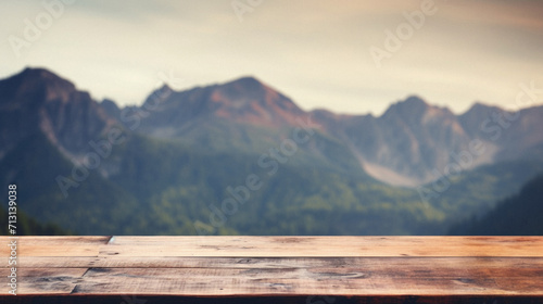 Wooden table mountains bokeh background, empty wood desk surface product display mockup with blurry nature hills landscape abstract travel backdrop advertising presentation. Mock up, copy space.