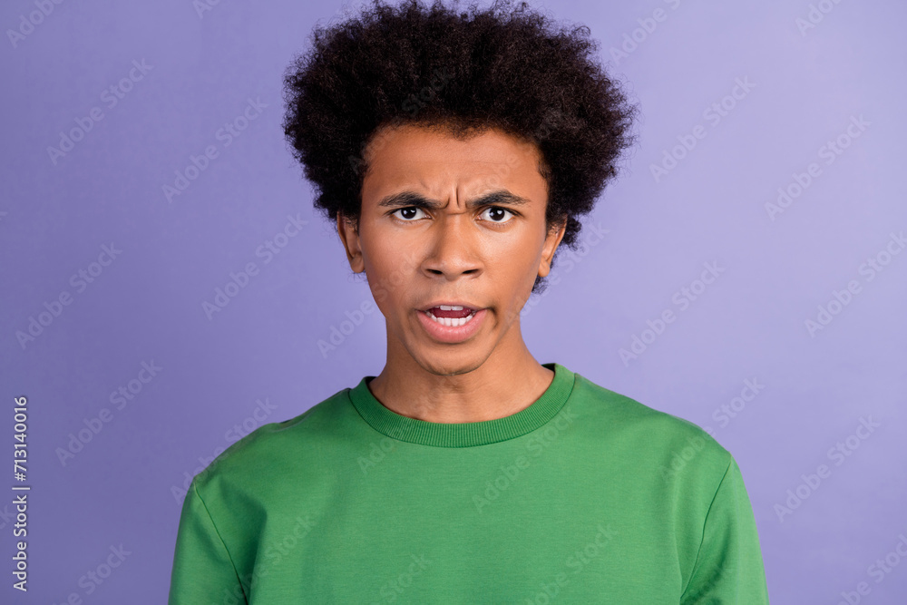 Photo of aggressive angry man dressed green sweater having problems isolated violet color background Photo of aggressive angry man dressed green sweater having problems isolated violet color background