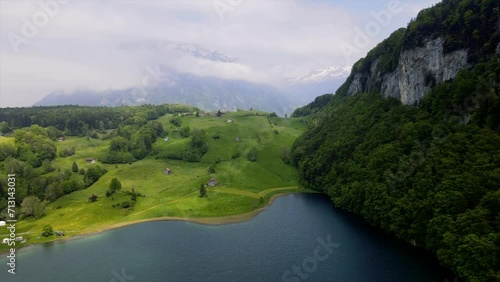 Swiss lake in idyllic lush green alpine scenery featuring the lake of Seeli in Seelisberg in the Alps of Switzerland photo