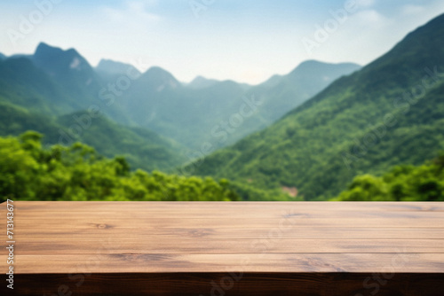 Wooden table mountains bokeh background, empty wood desk surface product display mockup with blurry nature hills landscape abstract travel backdrop advertising presentation. Mock up, copy space.