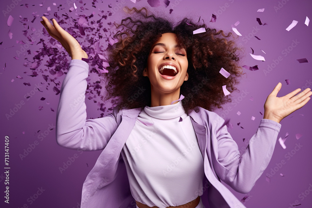 Energetic active lady dancing moving on holiday with flying confetti isolated on violet color background Energetic active lady dancing moving on holiday with flying confetti isolated on violet color background