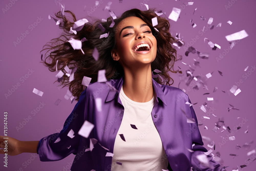Energetic active lady dancing moving on holiday with flying confetti isolated on violet color background