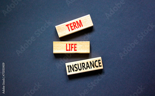 Term life insurance symbol. Concept words Term life insurance on beautiful wooden blocks. Beautiful black table black background. Medical term life insurance concept. Copy space.