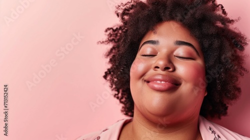 In a studio setting, a smiling plus-size woman exudes confidence.