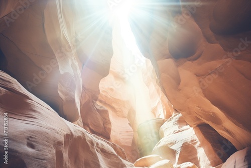 a narrow slot canyon with light beam shining down