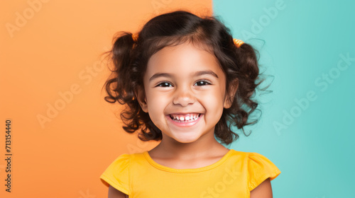 Cute little girl portrait on studio background photo