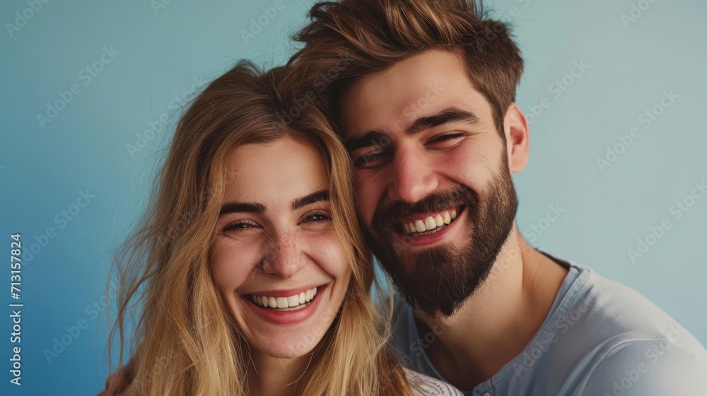 Stylishly posed and joyfully expressive young couple in a well-lit studio. Stylishly posed and joyfully expressive young couple in a well-lit studio.