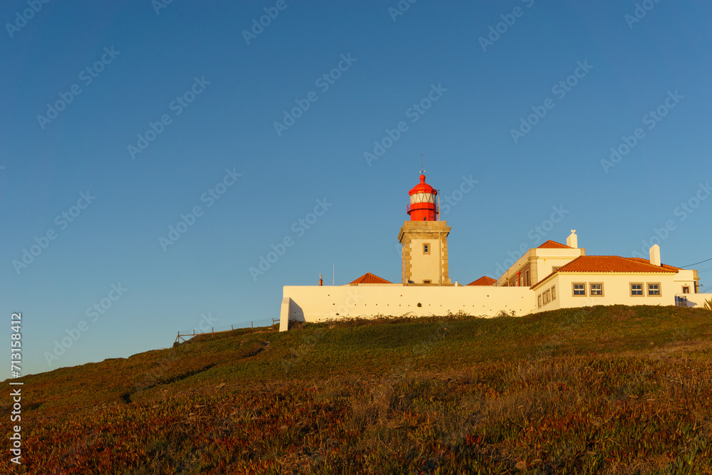 Lighthouse on the cliff at Cabo da Roca or Cape Roca is westernmost cape of mainland Portugal, Sintra, Lisbon, Portugal Lighthouse on the cliff at Cabo da Roca or Cape Roca is westernmost cape of mainland Portugal, Sintra, Lisbon, Portugal