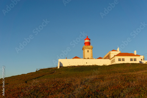Lighthouse on the cliff at Cabo da Roca or Cape Roca is westernmost cape of mainland Portugal, Sintra, Lisbon, Portugal