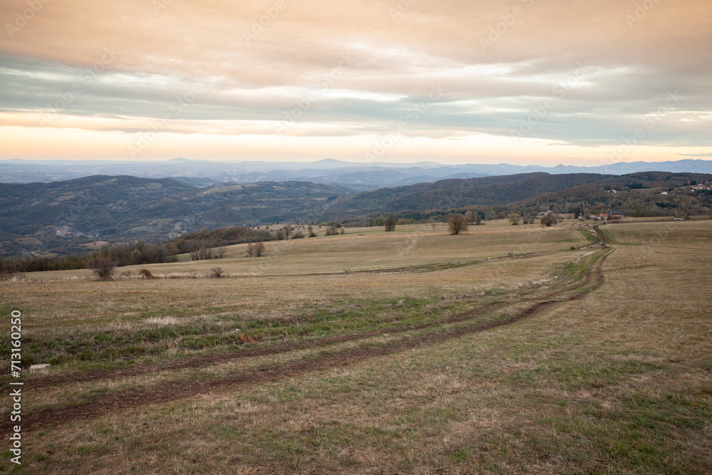 Fototapeta premium Panorama of the top and summit of Vrh Rajac moutain at dusk in autumn. Rajac is a mountain of Sumadija in Serbia, part of the dinaric alps, a major serbian natural touristic destination.