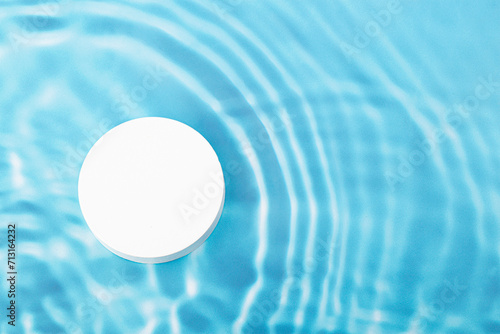 blue wave abstract or rippled water texture background. white podium for products display