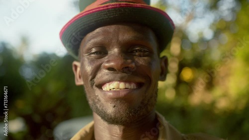 African Man From Karamoja Smiling At Camera In Uganda, Africa. - close up shot photo