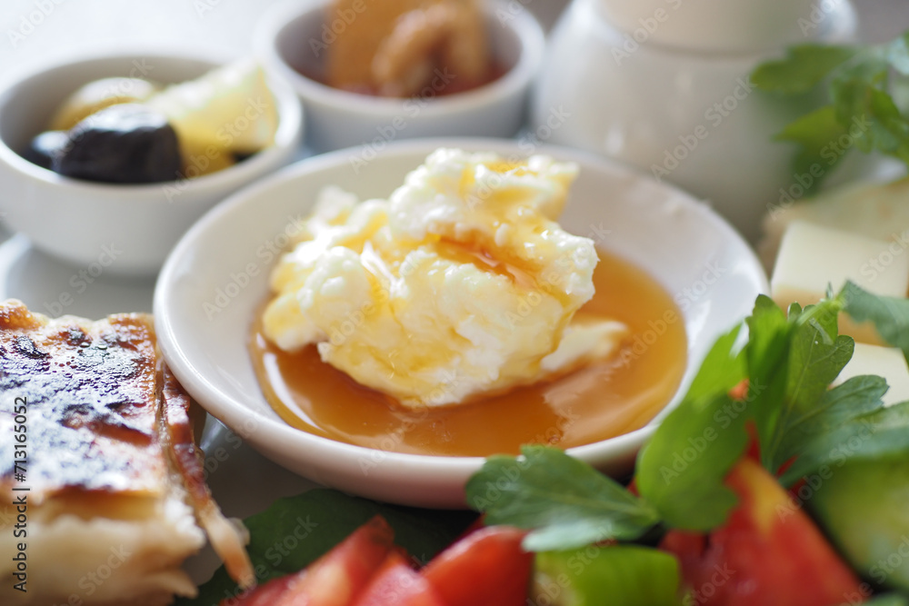 butter cream and honey served with salad, olive and cheese butter cream and honey served with salad, olive and cheese