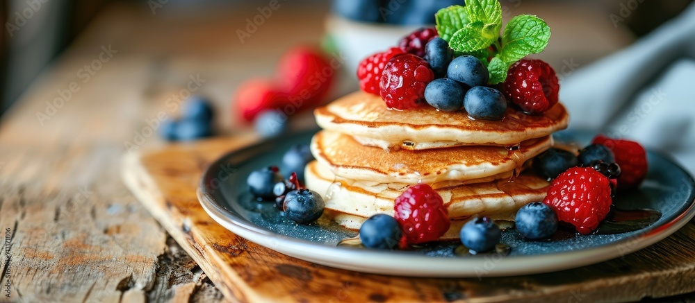 Pancakes with berries for kids. Copy space image. Place for adding text