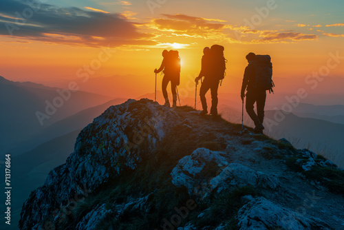 Climbers at Mountain Summit During Sunset
