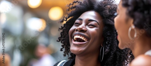 Happy african rewarded businesswoman laughing with joy excited black student talking on mobile phone with best friend share news about getting internship or dream job received highest honors in © Ilgun