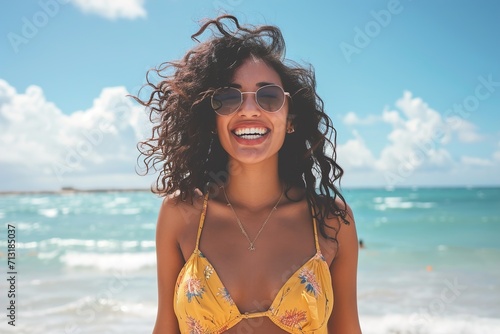 excited stylish latin hispanic woman standing at beach