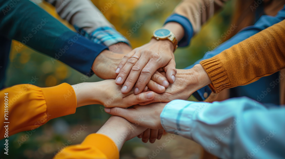 A group of people hands together, teamwork. A group of people hands together, teamwork.