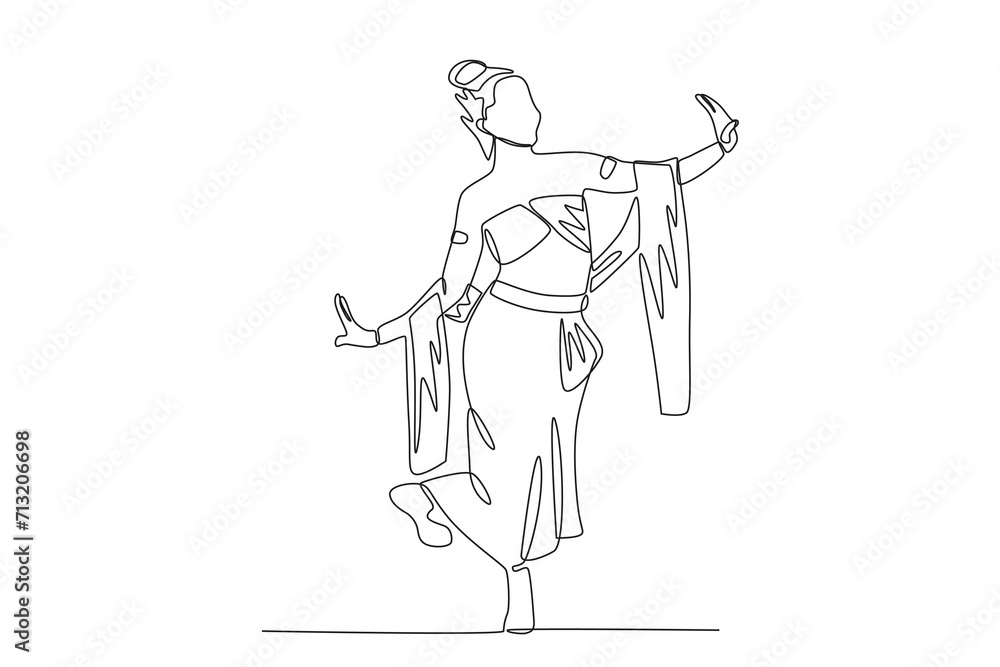 Fototapeta premium A woman performs a jaipong dance