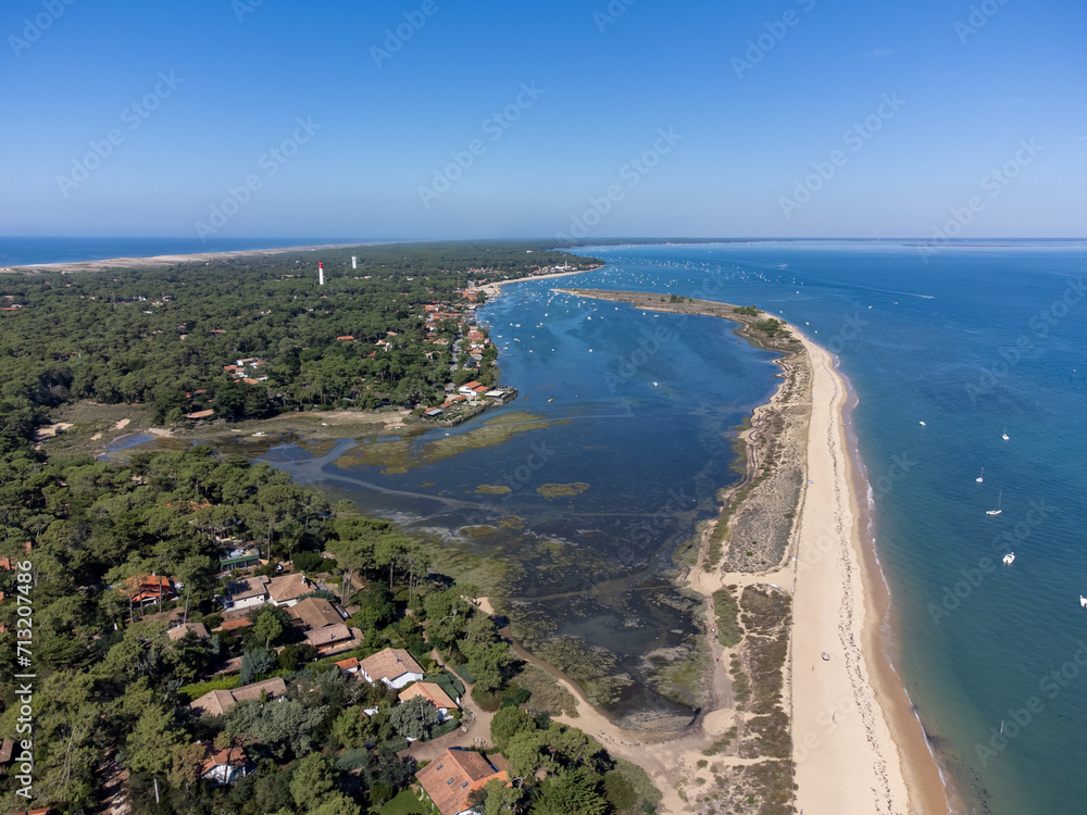 View on Arcachon Bay with many fisherman's boats and oysters farms near Le Phare du Cap Ferret and Duna du Pilat, Cap Ferret peninsula, France, southwest of Bordeaux, France's Atlantic coastline