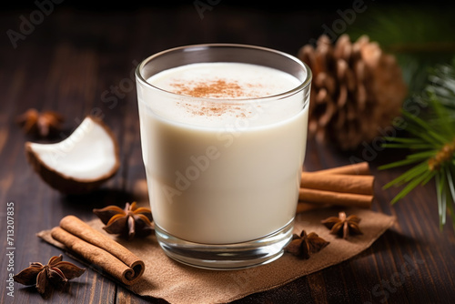 Glass of Coquito or Puerto Rican Eggnog traditional Christmas beverage with coconut milk and spices photo