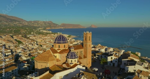 Aerial view of the city of Altea and the picturesque Mediterranean coast. Spain. An ancient Catholic church on the mountain as a landmark of the city of Altea photo