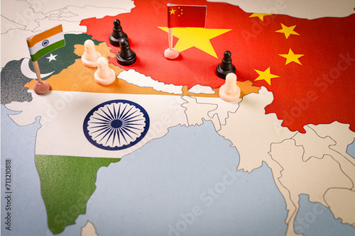 Fotografie Chess pieces over a map of Idnia and China