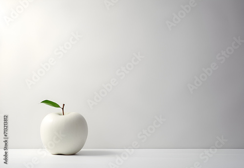 Apple painted white on the table