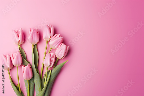 A bouquet of delicate pink tulips on a plain background. © Svitlana Sylenko