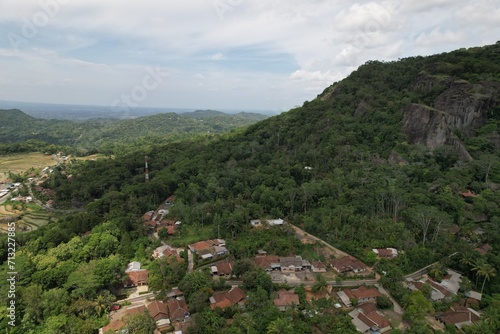 Nglanggeran Ancient Volcano in Gunungkidul Regency, Yogyakarta Indonesia. ancient volcano with large frozen lava rock formations. Indonesian landscape photo