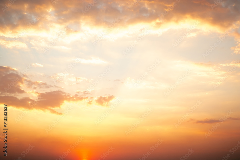 Obraz premium Beautiful , luxury soft gradient orange gold clouds and sunlight on the blue sky perfect for the background, take in everning,Twilight, Large size, high definition landscape photo