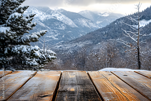 Rustic wooden table overlooking a snowy mountain landscape