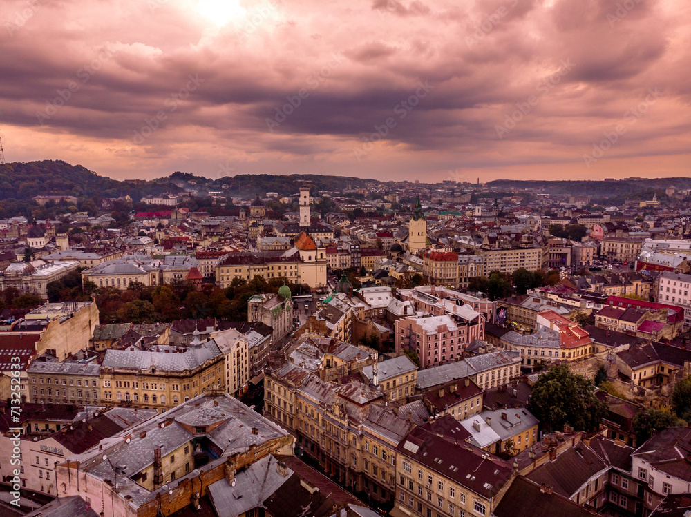 Aerial view of Lviv's historic cityscape at dusk, with a tapestry of vibrant, ancient buildings