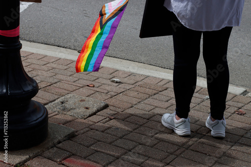 Holding a LGBT rights flag photo