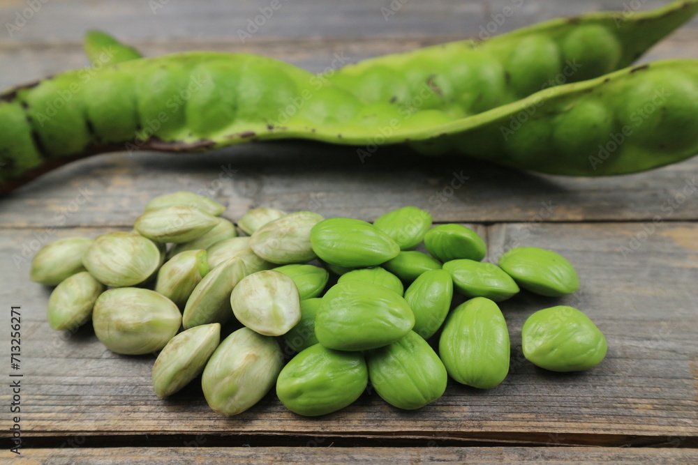 Raw of petai or pete kupas. Usually eaten raw and cooked popular with name stink bean or bitter bean Raw of petai or pete kupas. Usually eaten raw and cooked popular with name stink bean or bitter bean