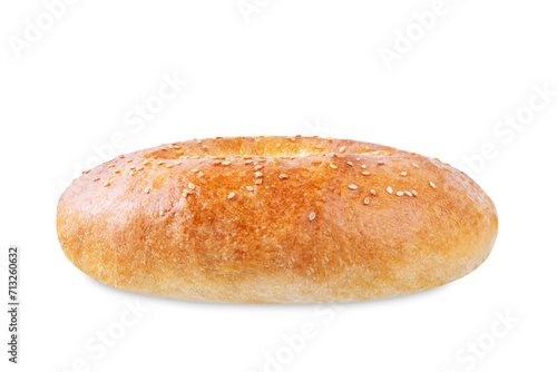 Sesame seeds round bun on a white isolated background