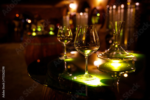 Quadro em tela Wine glasses and decanter in a vintage cellar.
